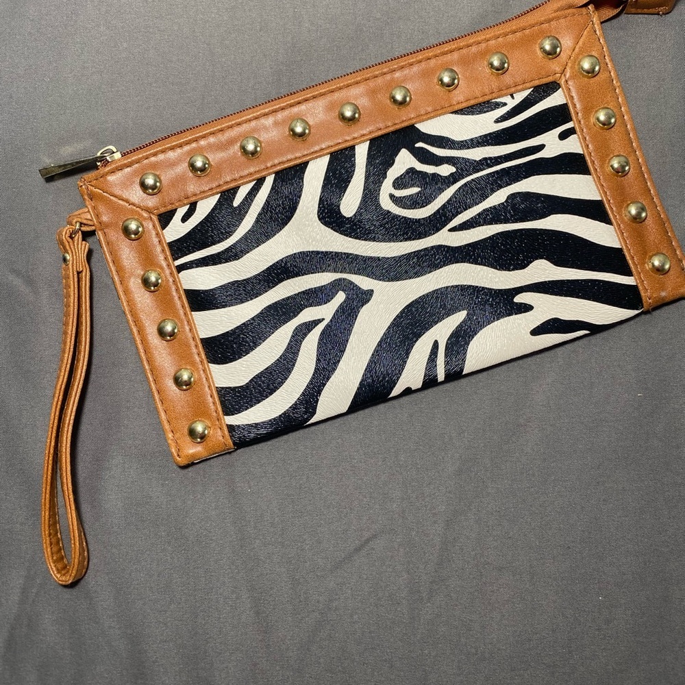 Zebra print wristlet with brown leather trim EUC
